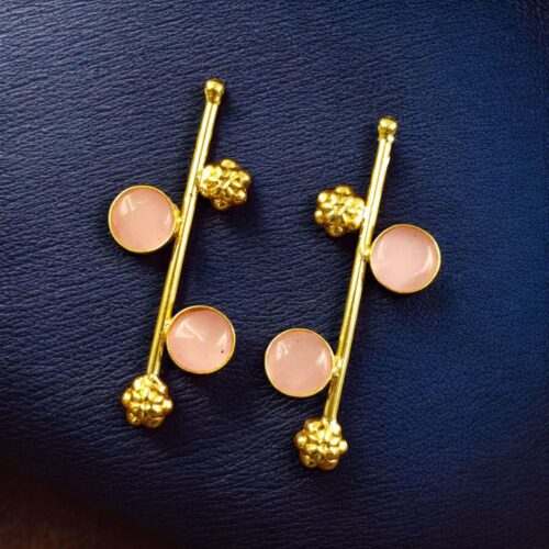 Gold plated flower earrings with stone work in western look alike design.