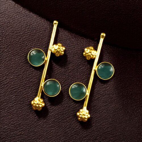 Gold plated flower earrings with stone work in western look alike design.