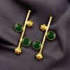 Gold plated flower earrings with stone work in western look alike design.