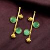 Gold plated flower earrings with stone work in western look alike design.