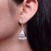 Oxidized German silver triangle jhumka earrings with pearl beads.