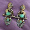 Antique two-tone peacock earrings with pearls and red stones