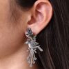 Stylish bird stud earrings with silver replica finish and stone detailing