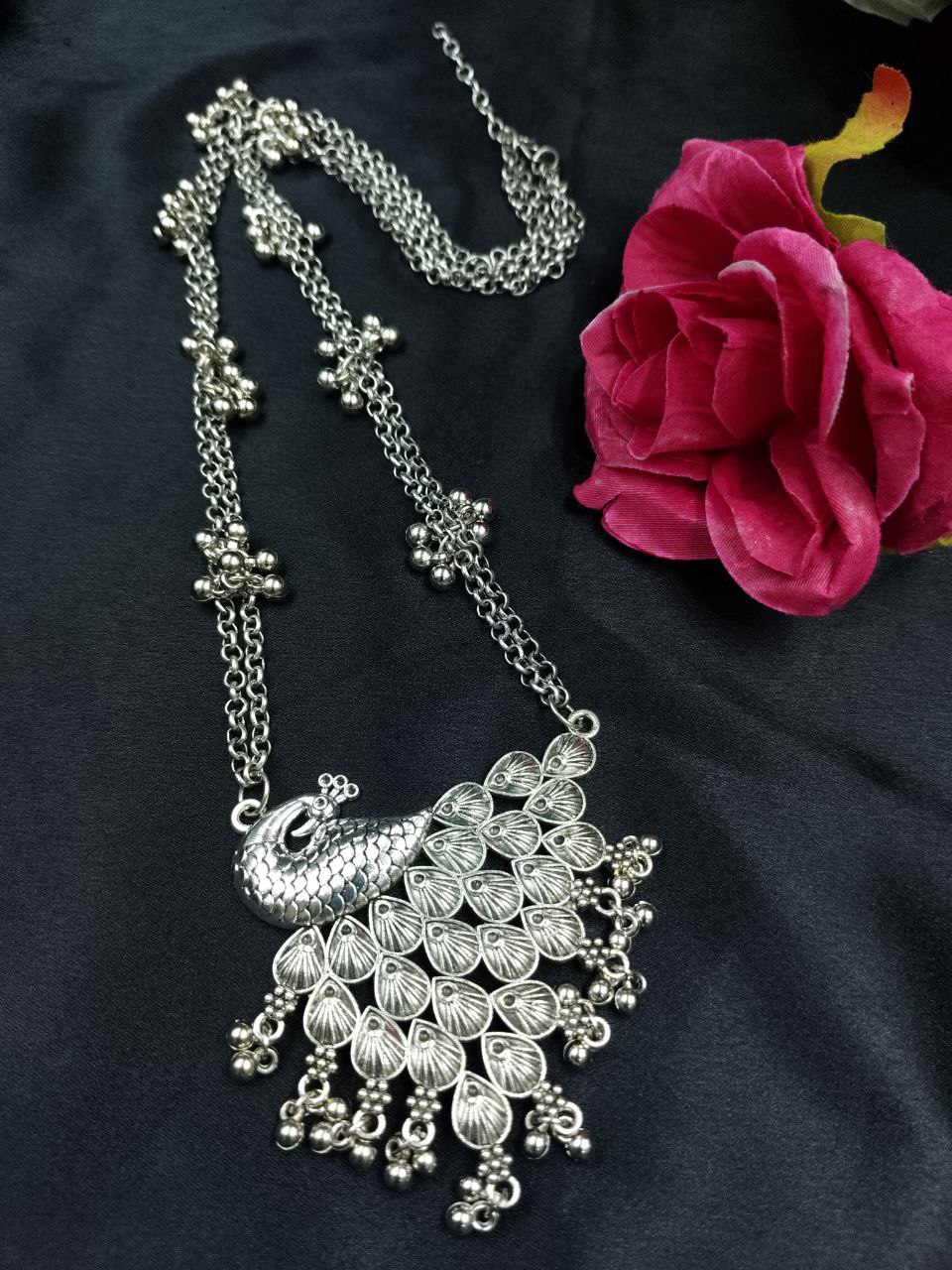 Unique Peacock Design Necklace | German Silver Ghungroo Chain Jewelry 1 German silver peacock design necklace with ghungroo chain detailing.