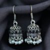 German silver pearl jhumka earrings with stone hook dangler design.