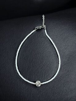 Ethnic silver replica rose charm anklet with white beads for women.