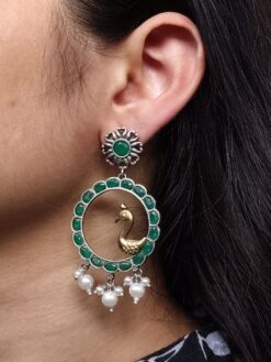 Traditional two-tone bird earrings with stone and pearl work.