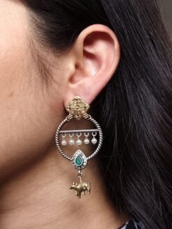 Ethnic Nandi dangler earrings with two-tone circle design, stone and pearl work.