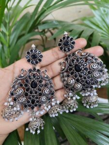 Long Peacock Dangler Earrings With Elegant Stone Work And Pearl Detailing - color: "Black"