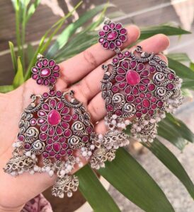 Long Peacock Dangler Earrings With Elegant Stone Work And Pearl Detailing - color: "Red"