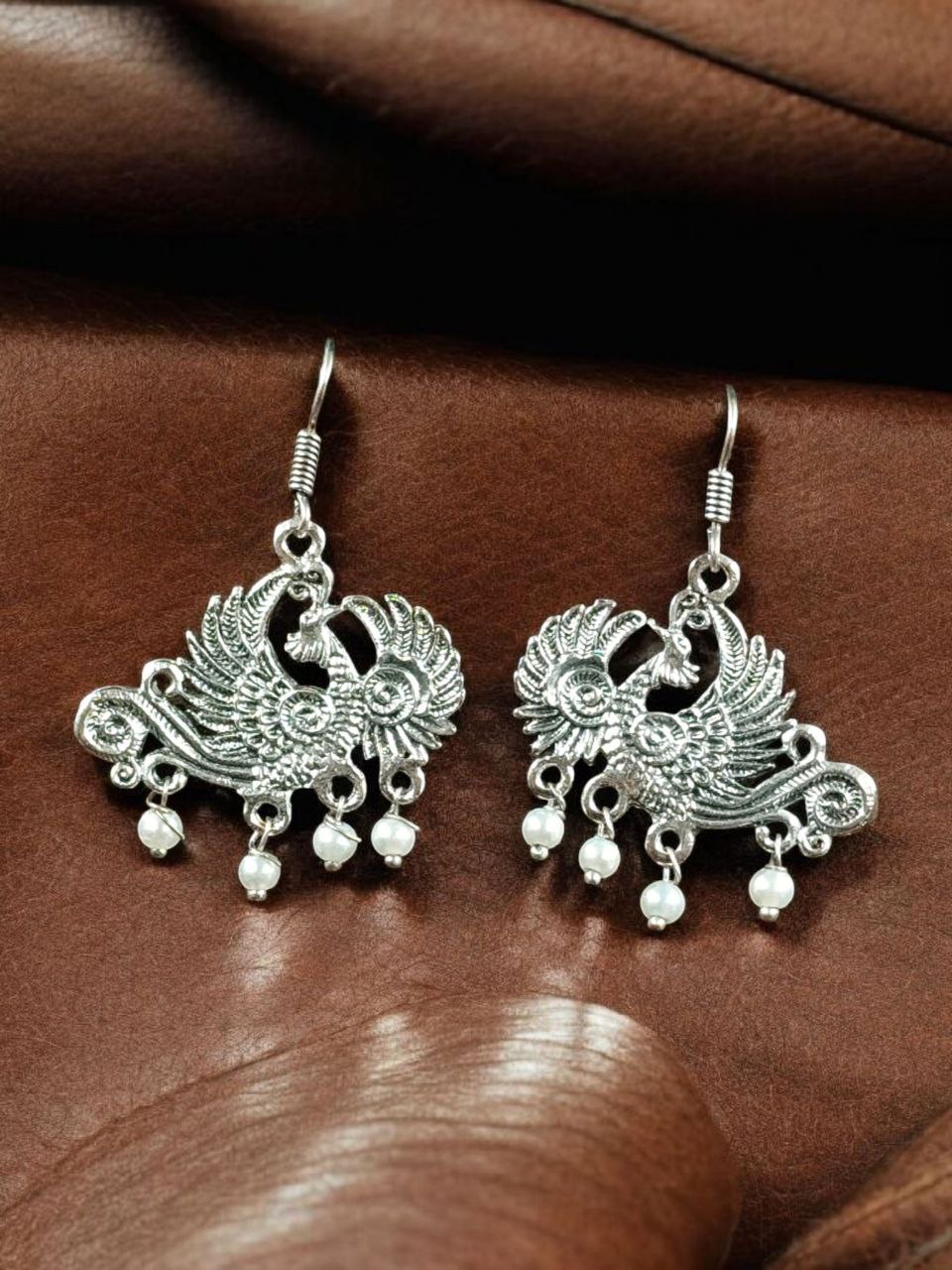 Elegant Peacock Dangler Earrings | German Silver Hook Design with Best Pearl Detailing 3 German silver peacock dangler earrings with pearl detailing