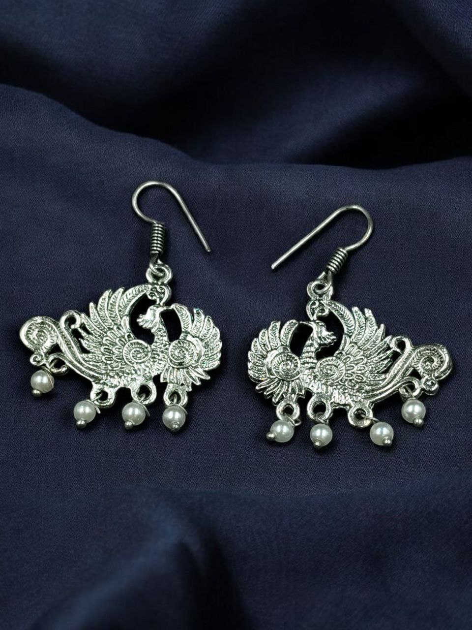 Elegant Peacock Dangler Earrings | German Silver Hook Design with Best Pearl Detailing 4 German silver peacock dangler earrings with pearl detailing