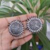Handcrafted oxidized floral art round stud earrings in silver replica ethnic design