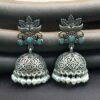 Oxidized silver floral art jhumka earrings with pearl work and vintage finish.