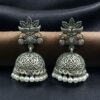 Oxidized silver floral art jhumka earrings with pearl work and vintage finish.