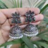 Oxidized silver floral art jhumka earrings with pearl work and vintage finish.