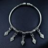Handcrafted German silver ethnic charm bangles for festivals.