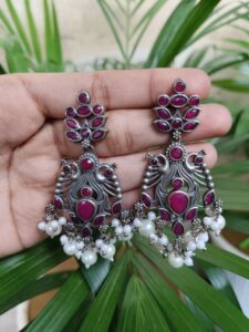 Elegant Peacock Design Earrings | Silver Replica Dangler with Stone & Pearl Detailing Best Jewelry - color: "Red"