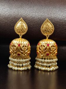 Traditional Floral Art Gold Plated Jhumka Earrings | Stone & Pearl Detailing Unique Dangler Jewelry For Women - color: "Red"