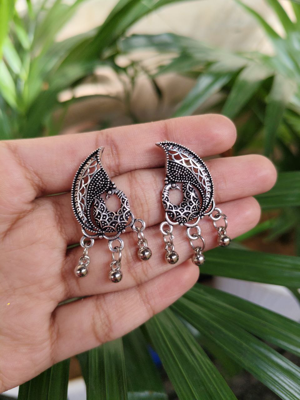 German Silver Peacock Stud Earrings With Traditional Ghungroo Detailing 1 German Silver Peacock Stud Earrings With Traditional Ghungroo Detailing