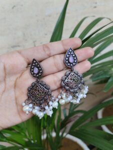 Silver Plated Dangler Earrings With Elegant Stone And Pearl Work Design