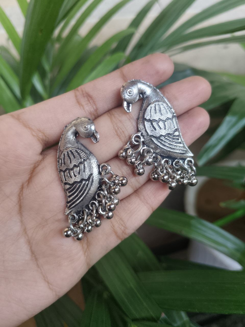 Oxidized Silver Plated Bird Stud Earrings With Traditional Ghungroo Detailing 1 Oxidized Silver Plated Bird Stud Earrings With Traditional Ghungroo Detailing