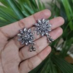 Silver Plated Flower Stud Earrings With Elegant Ghungroo Detailing