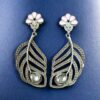 Oxidized silver replica peacock feather design dangler earrings for women.