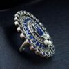 Oxidized adjustable ring with pearl and stone detailing in traditional vintage design.