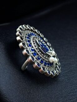 Oxidized adjustable ring with pearl and stone detailing in traditional vintage design.