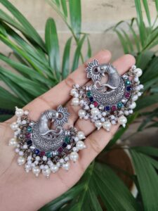 Elegant Silver Plated Peacock Stud Earrings with Beautiful Pearl and Stone Work Design - color: "Multi"