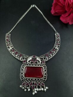 Antique finish elephant hasli necklace with floral art stone and pearl detailing