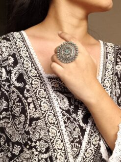 Oxidized adjustable ring with pearl and stone detailing in traditional vintage design.