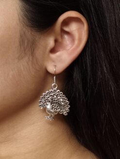 Stylish oxidized German silver peacock dangler earrings