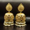 Floral art gold plated jhumka earrings with stone and pearl detailing