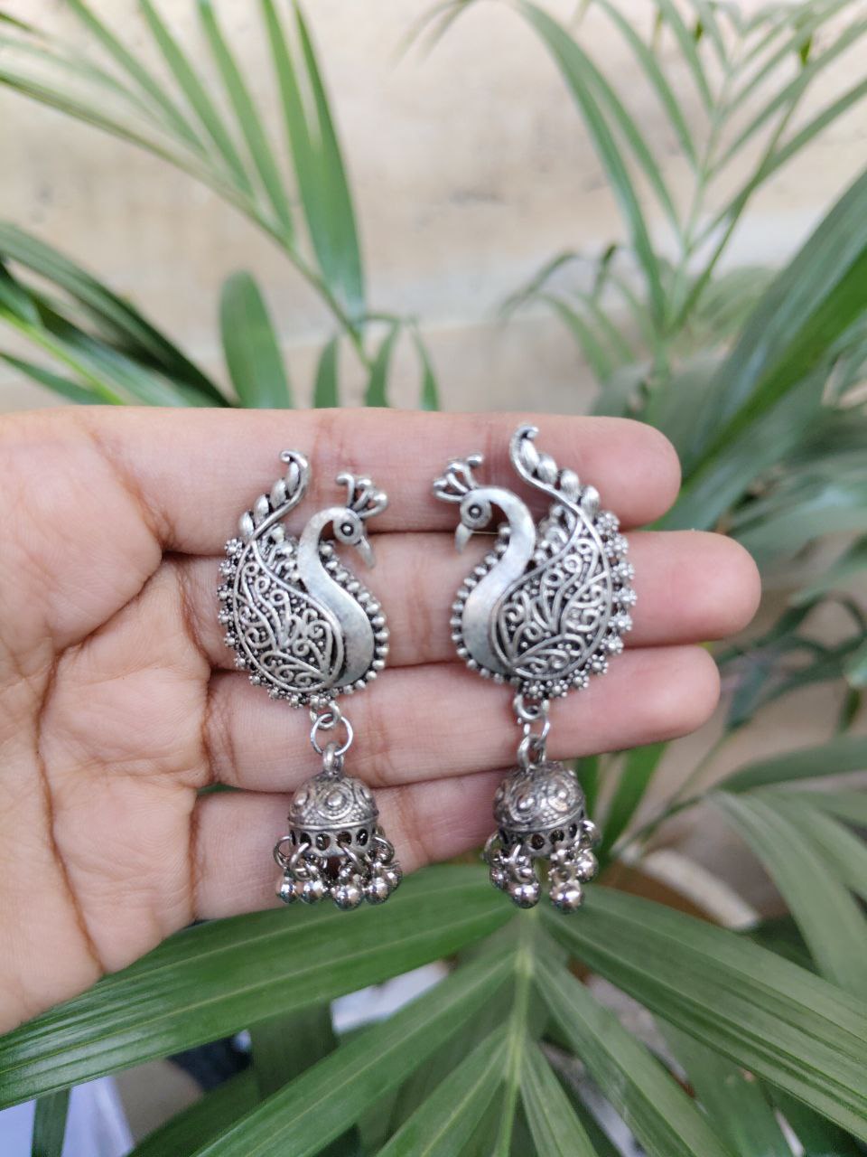 Peacock German Silver Stud Jhumka Earrings with Hanging Design and Elegant Pearl Work 1 Peacock German Silver Stud Jhumka Earrings with Hanging Design and Elegant Pearl Work