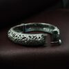 Openable oxidized silver replica floral art kada bangle for women.