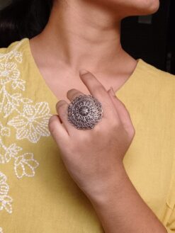 A unique oxidized adjustable ring featuring a bird motif and pearl accent, crafted in premium silver replica finish.