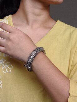 Openable oxidized silver replica floral art kada bangle for women.