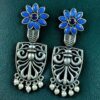 Oxidized silver replica flower dangler earrings with pearl and stone work.