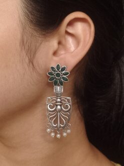 Oxidized silver replica flower dangler earrings with pearl and stone work.