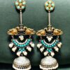 Two-tone bird design jhumka earrings with pearl and stone