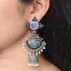 Meenakari silver replica long jhumki earrings with stone and pearl work.