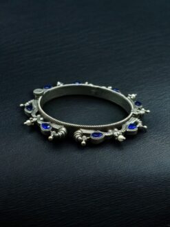 Oxidized silver replica peacock design bangle with stone and pearl work