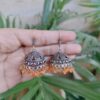 Elegant Silver Plated Jhumka Earrings Featuring Charming Orange Pearl Accents