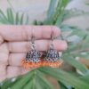 Silver Plated Jhumka Earrings Adorned with Beautiful Orange Pearl Detailing