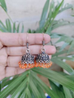 Silver Plated Jhumka Earrings Adorned with Beautiful Orange Pearl Detailing