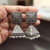 Oxidized silver replica jhumka earrings with floral art and pearl detailing