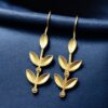 Gold plated leaf design hook earrings