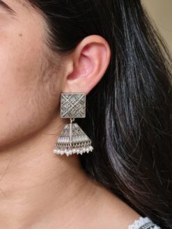 silver replica Oxidized jhumka earrings with floral art and pearl detailing